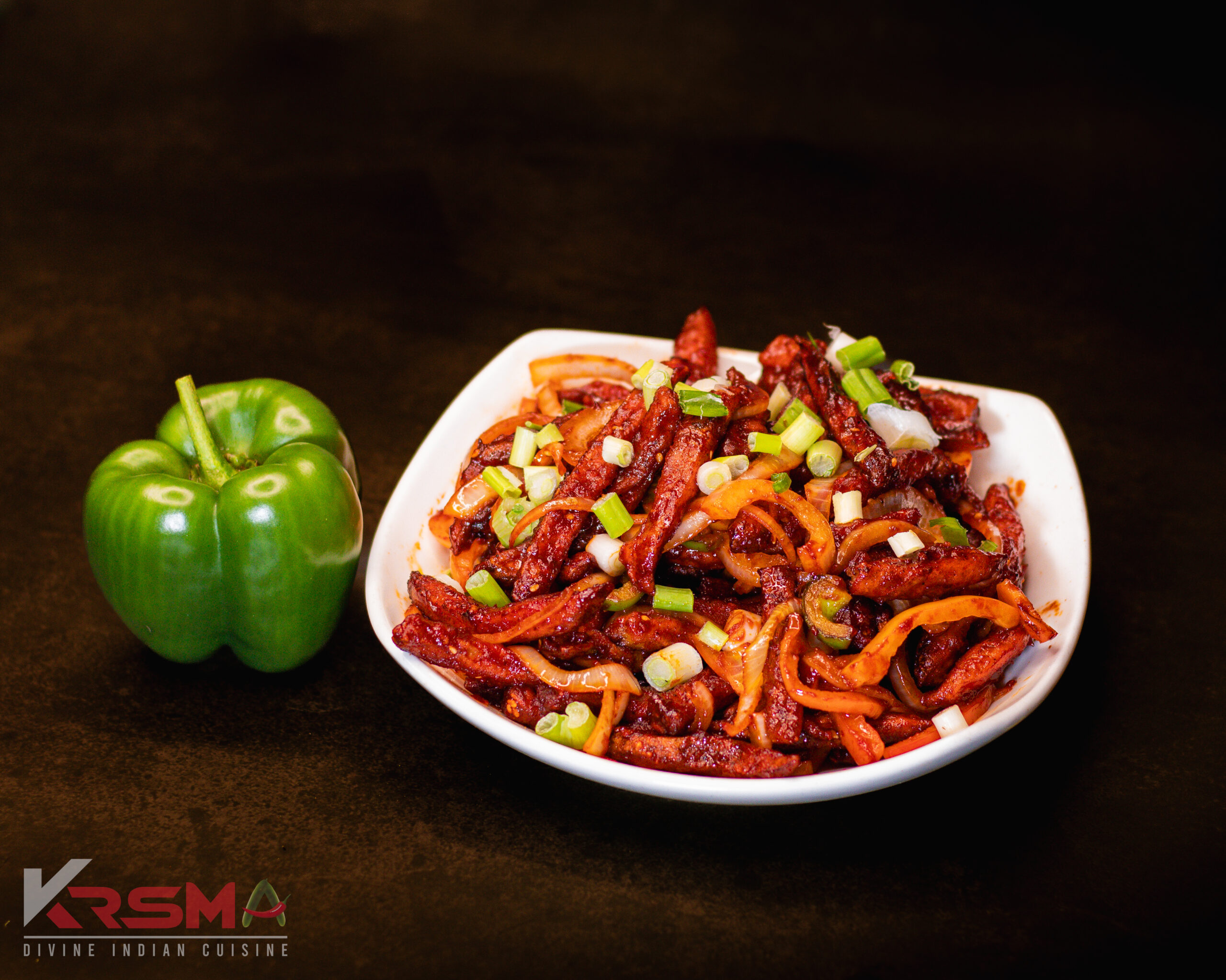 Chili Potato - Crispy, flavorful potato fingers tossed in a tangy, spicy sauce, served fresh at Krsma Indian Cuisine.