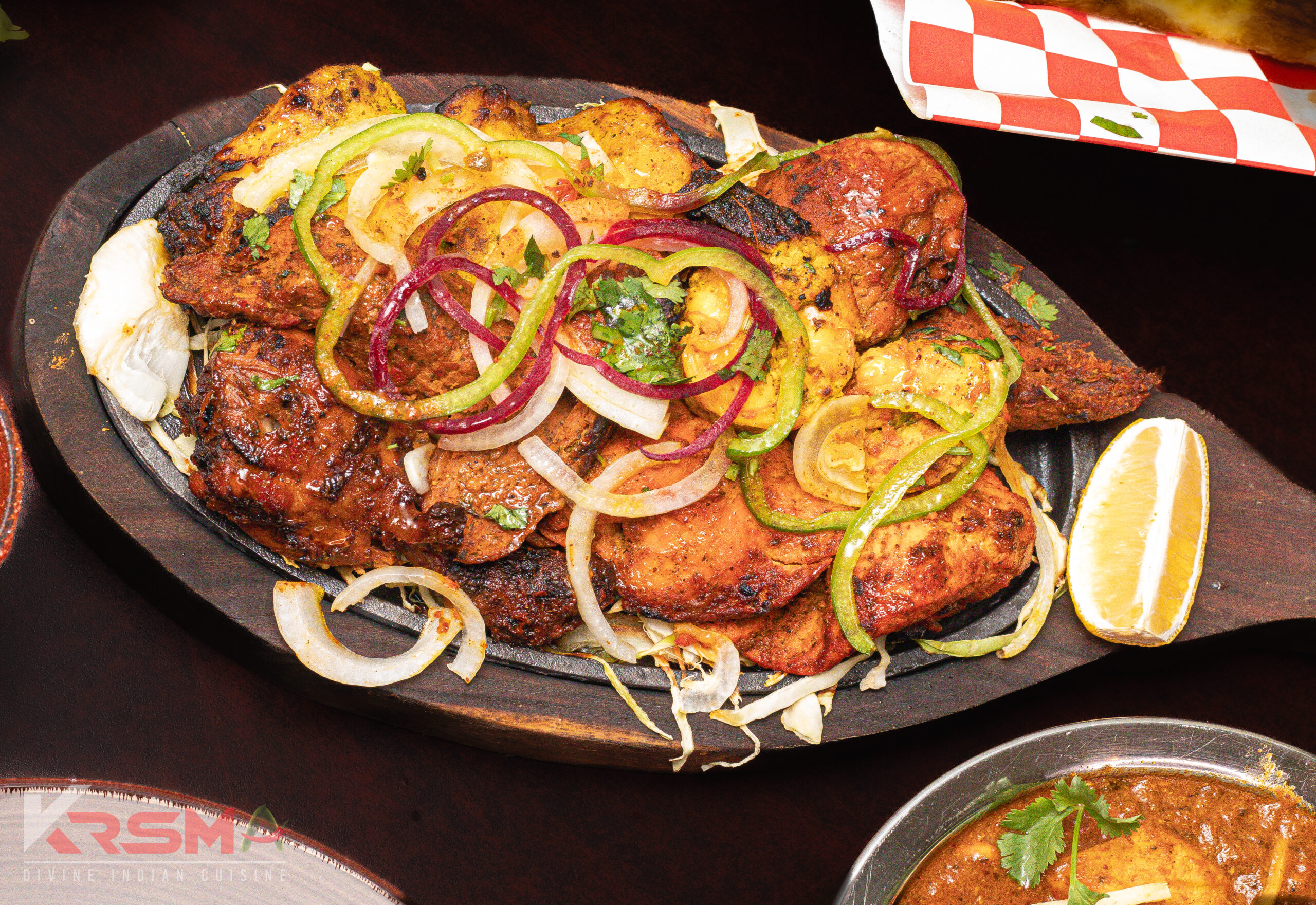 Mixed Grill - A sizzling platter with Fish Tikka, Lamb Kebab, Chicken Tikka, and Prawn Tikka, served fresh at Krsma Indian Cuisine, Vancouver’s top Indian restaurant.