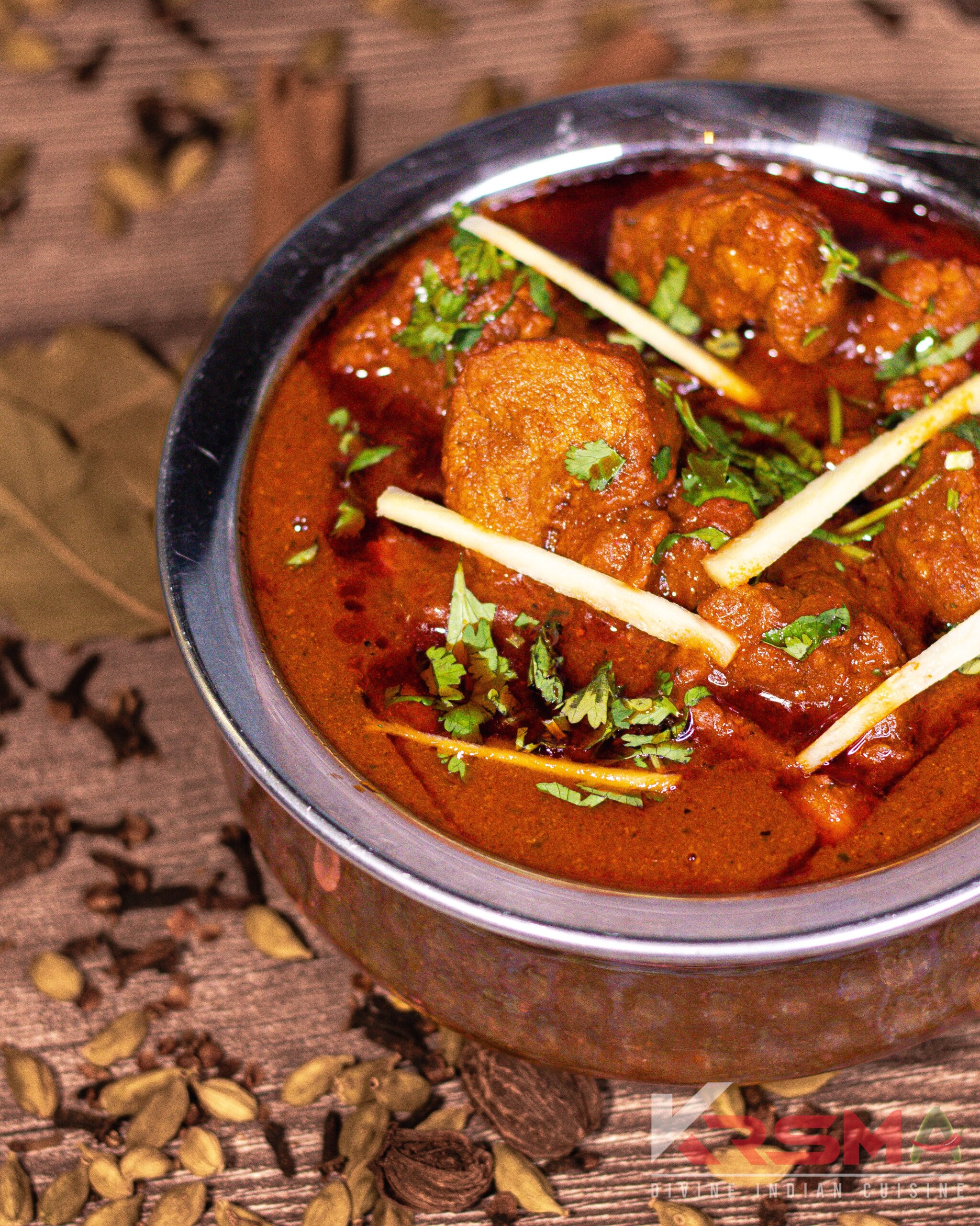 Rogan Josh - Tender lamb cooked in a flavorful, aromatic gravy, served fresh at Krsma Indian Cuisine, Vancouver's top Indian restaurant.