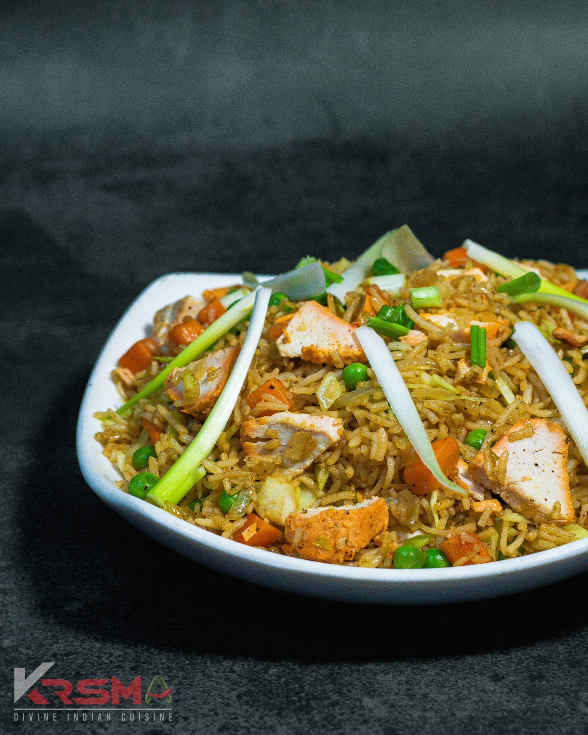 Chicken Fried Rice - Flavorful fried rice with tender chicken and spices, served fresh at Krsma Indian restaurant.