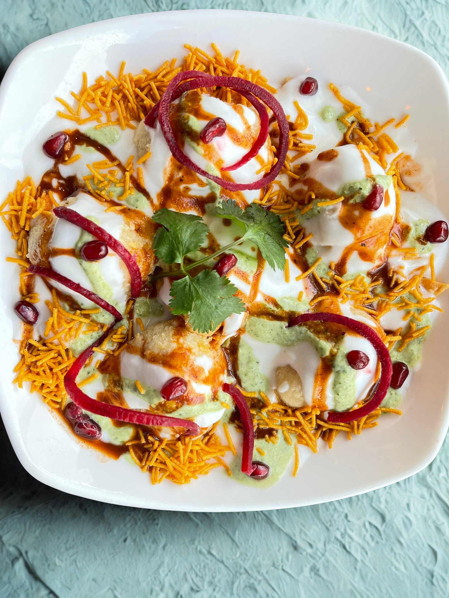 Chicken tikka on a sizzler with a squeeze of lemon at KRSMA Vancouver