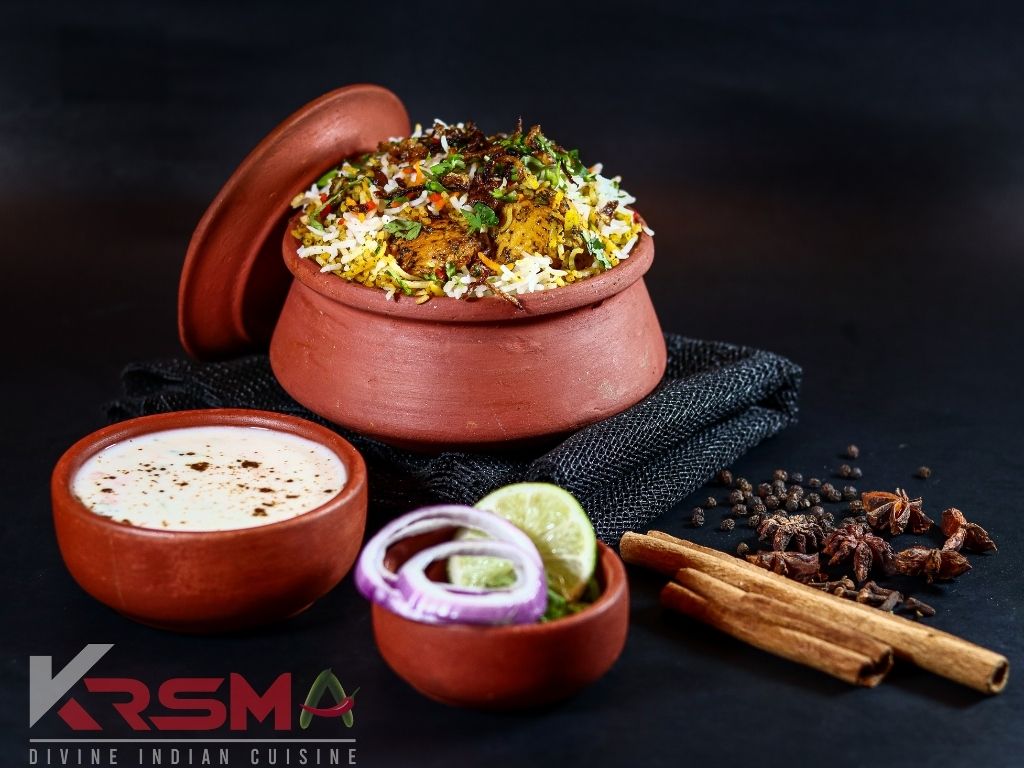 Chicken biryani in a clay pot with raita at KRSMA Indian Restaurant, Victoria Drive, Vancouver